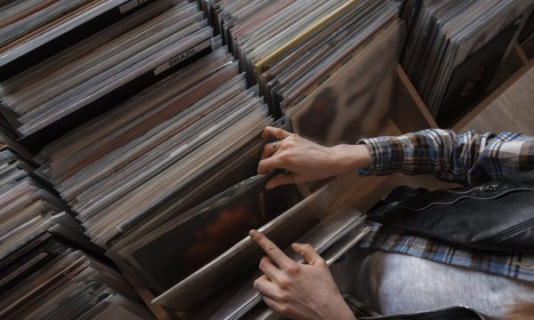 female hands browsing vinyl records in a store female hands browsing vinyl records in a store