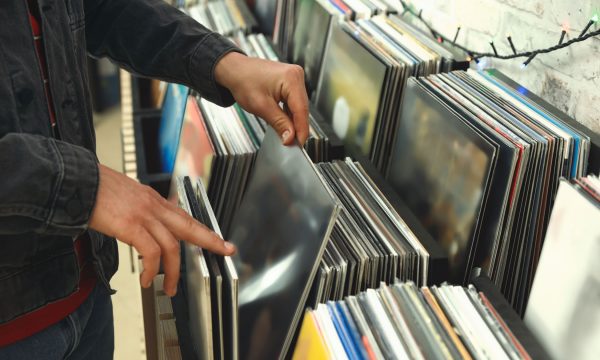 Man choosing vinyl records in store, closeup Man choosing vinyl records in store, closeup